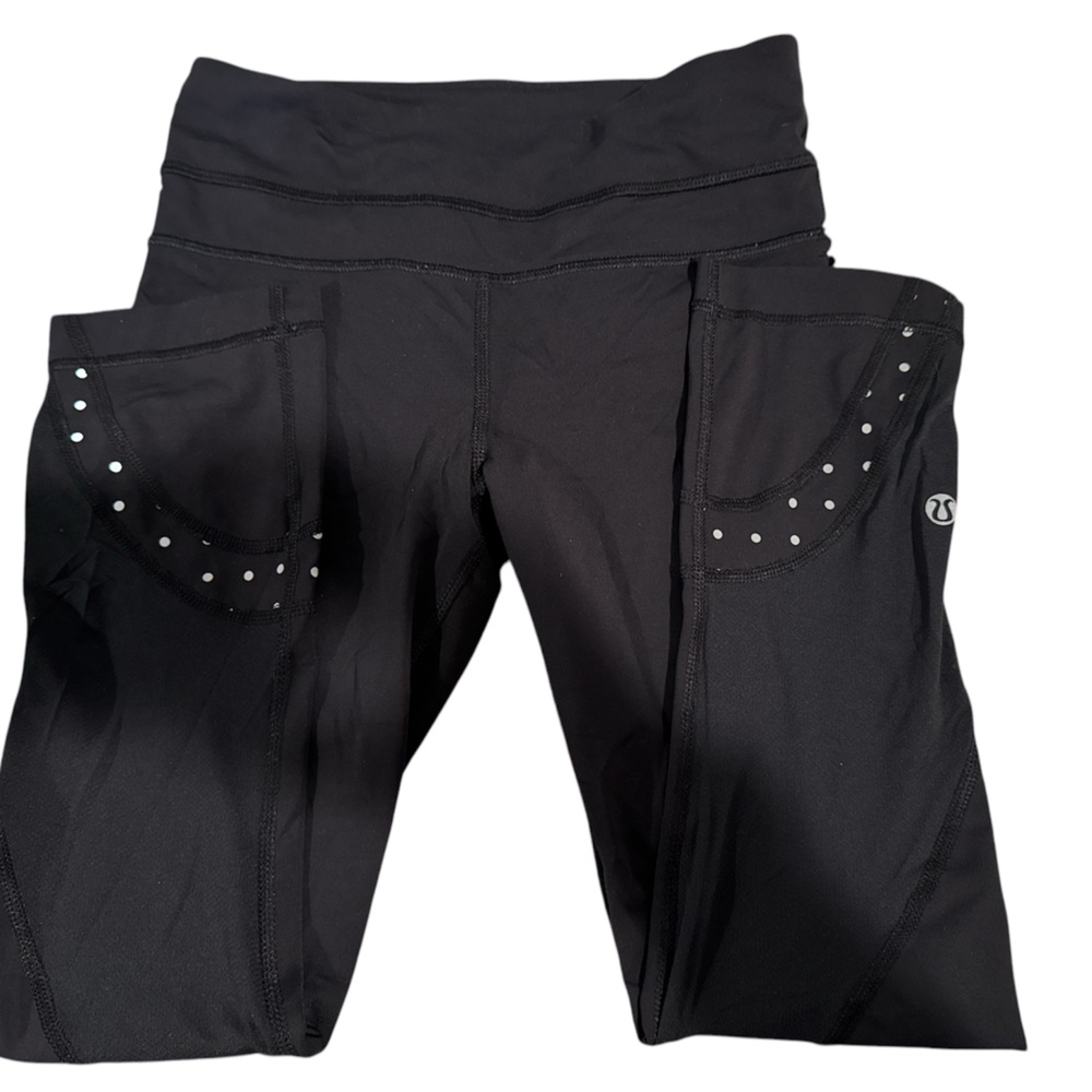 Lululemon "Just Breathe Crop" style in black with a mesh polka dot detail.
